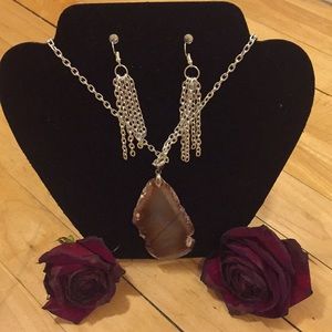 Natural brown stone pendant on silver chain.